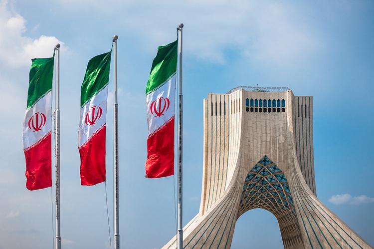 Azadi Tower in Tehran with flasgs of Iran (copyright by Shutterstock/Kanisorn Pringthongfoo)