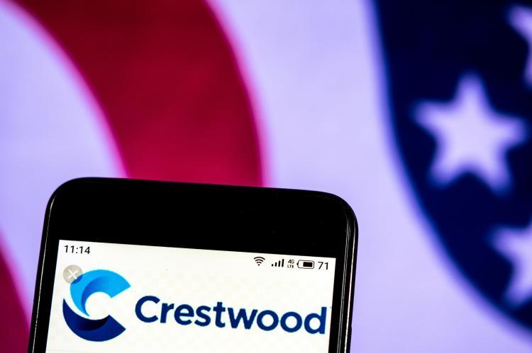 Crestwood logo on a phone screen (© Shutterstock/IgorGolovniov)