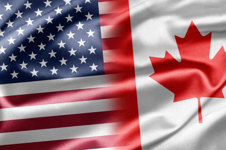Flags of Canada and the USA (© Shutterstock/ruskpp) 