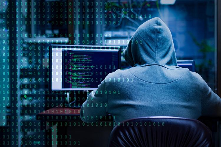 Hacker trying to breach a security system (copyright by Shutterstock/Pira25) 