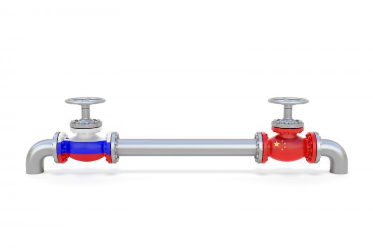 Pipe line and valves (faucets) with national flags of Russia and China (copyright by Shutterstock/Aksabir)