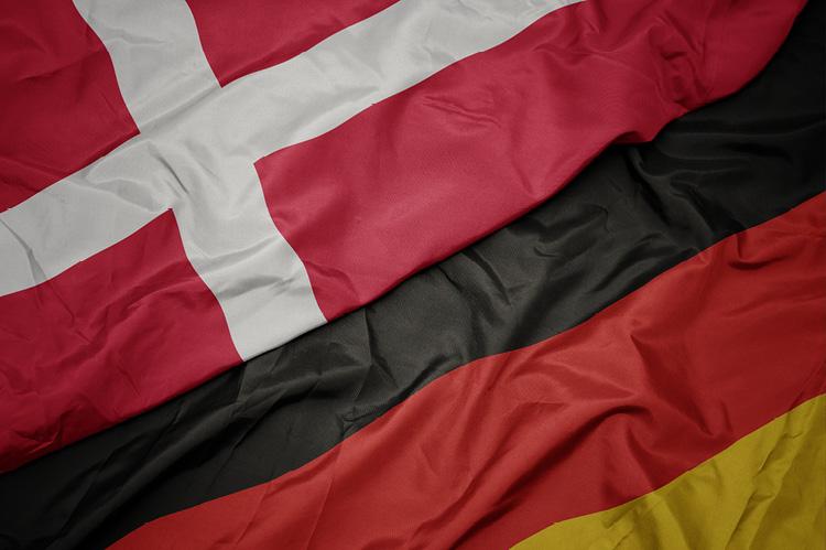 Waving flags of Denmark and Germany (copyright by Shutterstock/esfera)