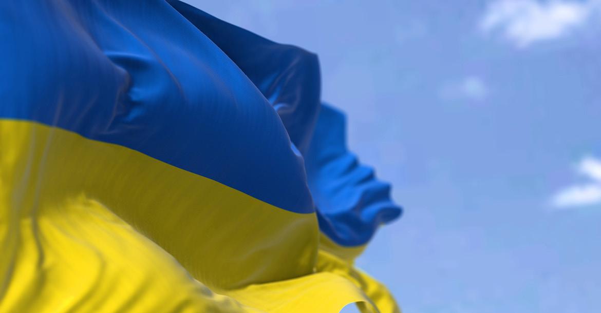 Flag of Ukraine waving in the wind on a clear day (© Shutterstock/rarrarorro)