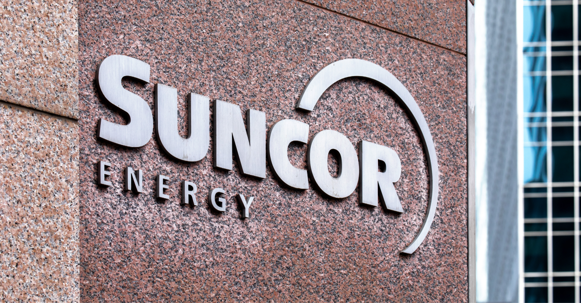 Logo of Suncor Energy next to the company hq in Calgary, Canada (© Shutterstock/sockagphoto)