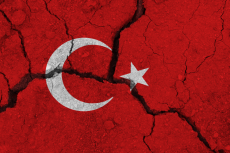 Flag of Turkey on cracked ground (© Shutterstock/Olleg Visual Content)