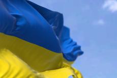 Flag of Ukraine waving in the wind on a clear day (© Shutterstock/rarrarorro)